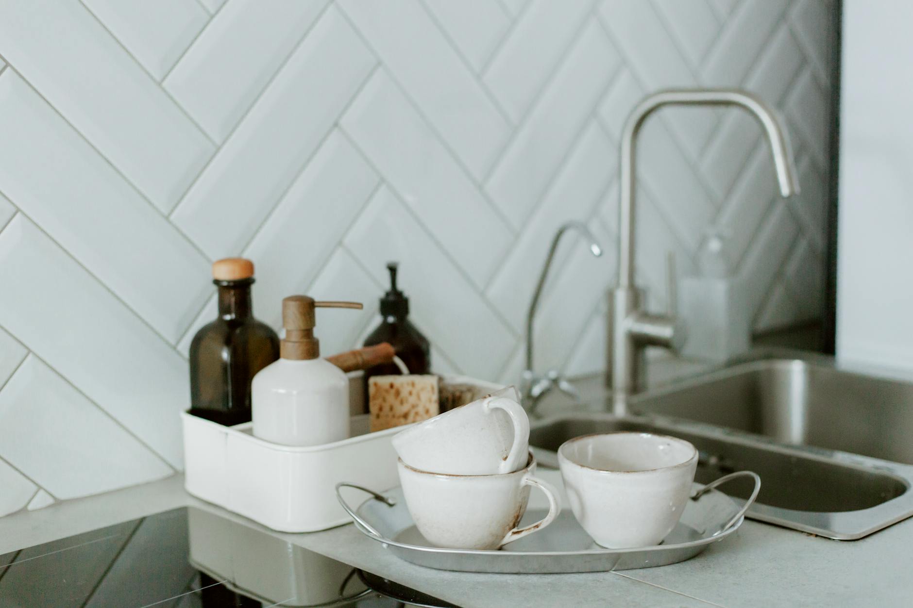 Small kitchen counter with a few easy-clean kitchen tools and a tidy sink area