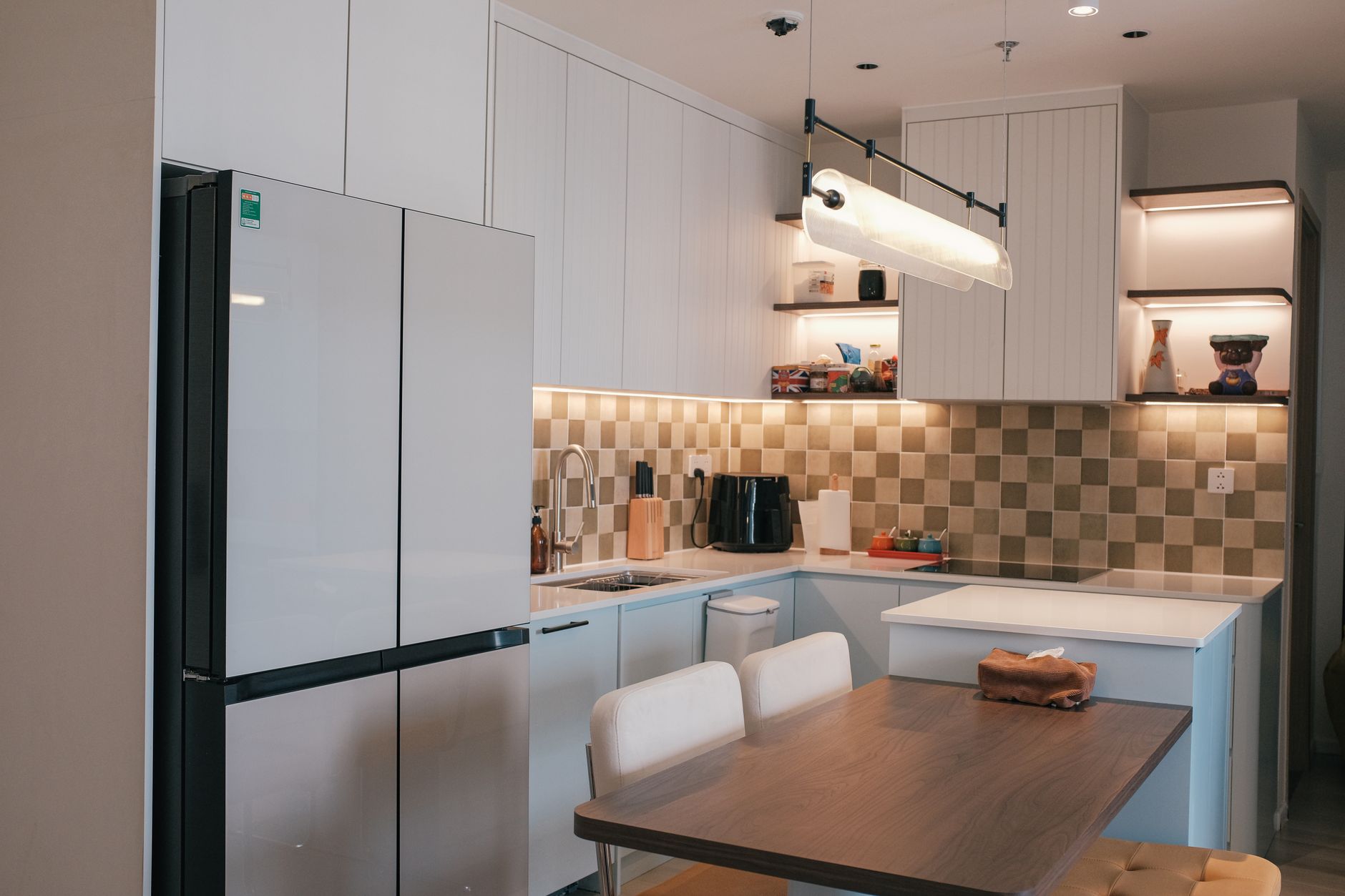 A warm kitchen with open shelves styled simply and neatly