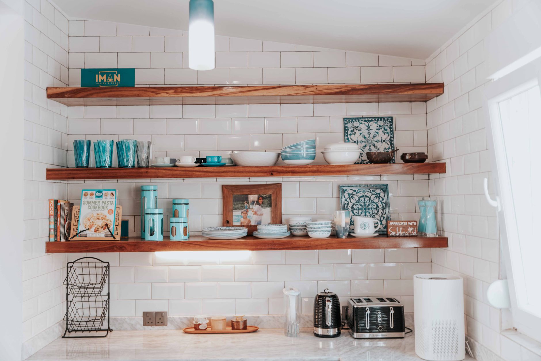 Minimal kitchen with open shelving and neatly arranged dishes