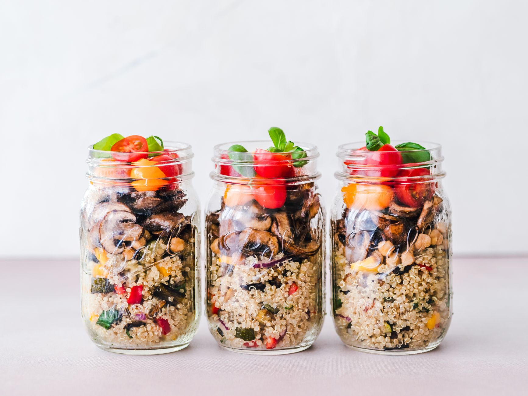 Neatly organized kitchen containers and lunch prep items on a countertop