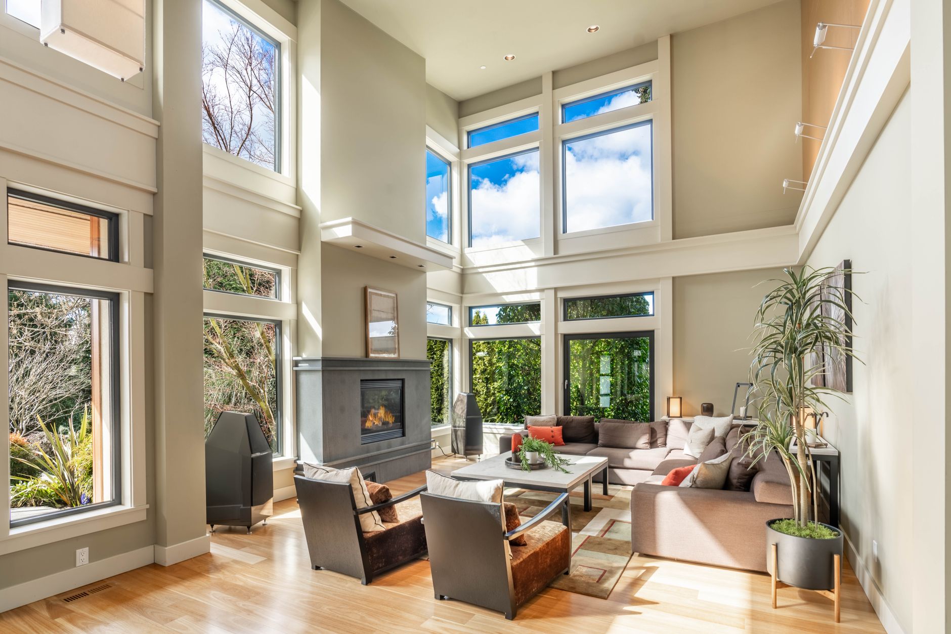 A thoughtfully arranged living room with balanced furniture and warm natural light